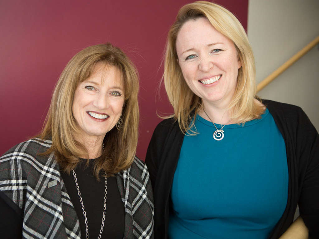 Michele Sarkisian, president of P3Advisors.biz; and Kelly A. McGuire, MMH ’01, PhD ’07, vice president, advanced analytics for Wyndham Destination Network  — Photo by Wyndham
