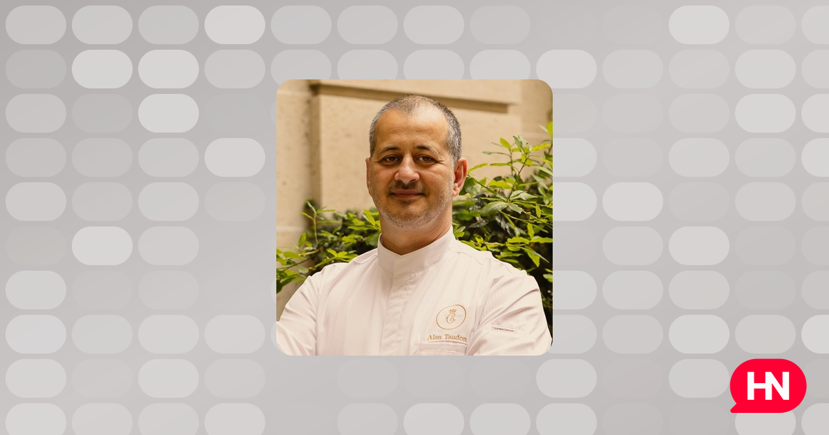Chef Alan Taudon on a terrace next to a kitchen garden, likely at Hôtel de Crillon