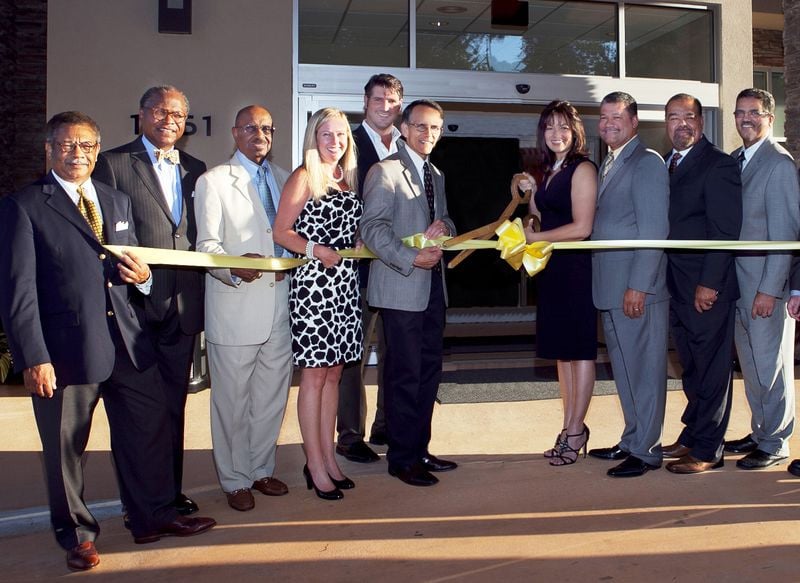 Ribbon cutting (2011) for the grand opening of the SpringHill Suites by Marriott Lake Charles. From left to right: Jack Ezzell, Alvin Schexnider, William Grace, Tamra Markham (hotel management group), Lake Charles City Councilman John Falgout, Lake Charles Mayor Randy Roach, Evette Gradney, John Biagas, Mark Biagas, Randy Biagas.— Photo by Marriott