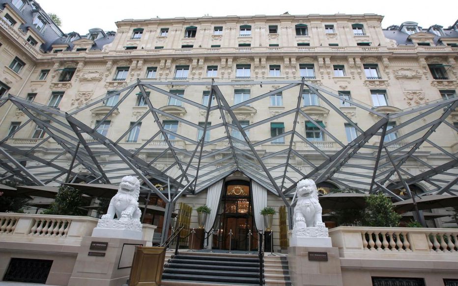 Lions outside the door of The Peninsula, Paris— Photo by Copyright Suzanne Godfrey