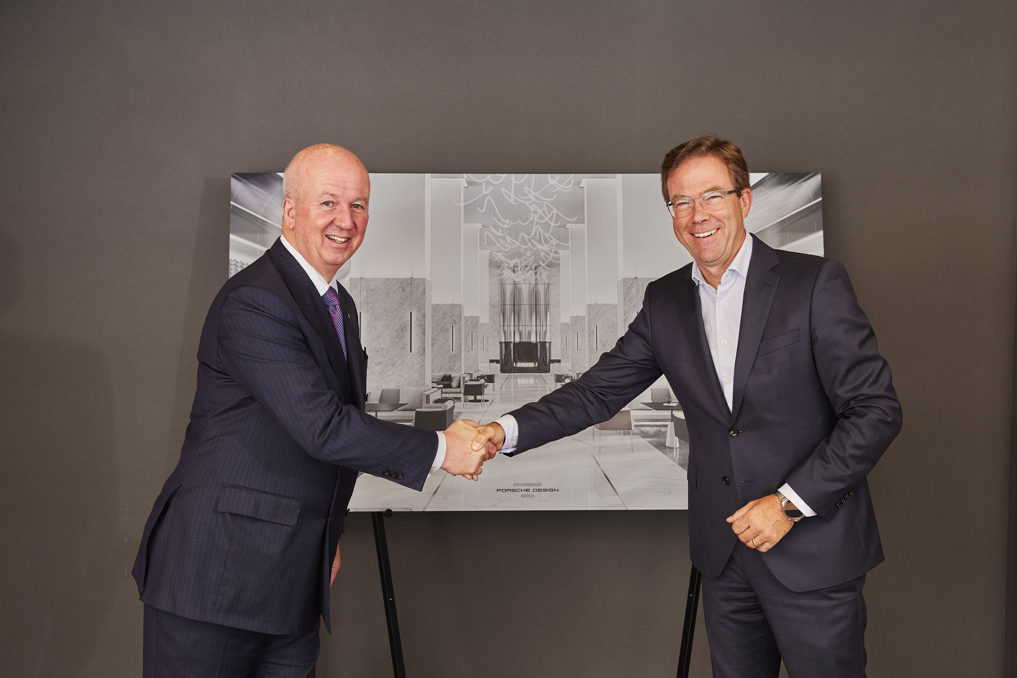 Marcus Bernhardt, CEO Steigenberger Hotels AG/Deutsche Hospitality, Dr. Jan Becker, CEO Porsche Design Group (from left to right) 
— Photo by Image source: Steigenberger Hotels AG/Porsche Design Group