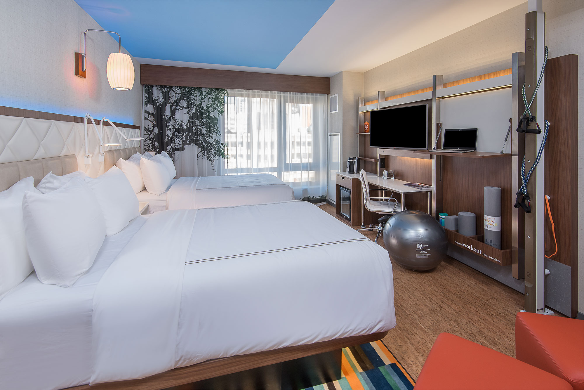 In-room fitness zone, double queen guest room— Photo by IHG