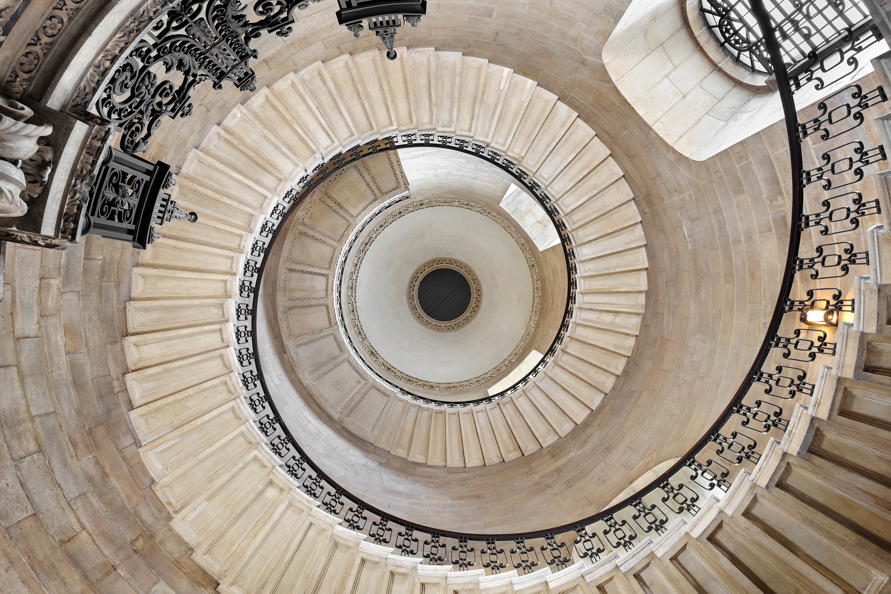 Guests will climb the famous Geometric Staircase to access the Hidden Library of St Paul's Cathedral. — Photo by Airbnb