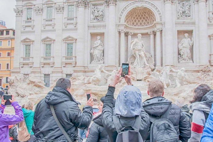 Taking a picture with an unobstructed view of the historic Trevi Fountain in Rome is almost impossible during peak travel times.— Source: EHL