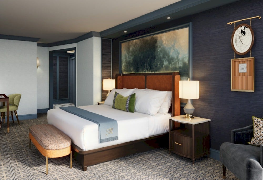 Color-drenched entry walls create contrast—making the guest room feel brighter and more expansive at the Mayflower Hotel, Autograph Collection— Source: Baskervill