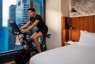 Hilton and Peloton Elevate Wellness Travel Through In‑Room Fitness Experience