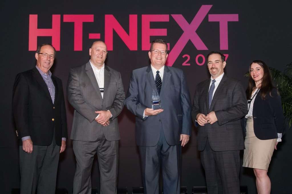 Pictured Left to Right: Joh Burns, Hospitality Technology Consulting (HT-NEXT Awards Emcee); Rob Graves, Datatrend Technologies, Inc. (HT-NEXT Awards Sponsor); Ted Helvey, Angie Hospitality; Mike Blake, HTNG; Dorothy Creamer, HT Magazine — Photo by Nomadix, Inc.