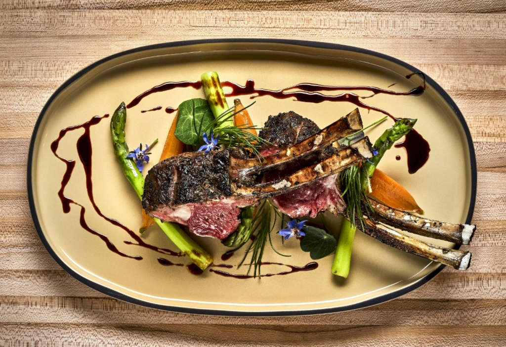 Tocca Ferro Rack of Lamb using seed-to-table garnishes— Photo by Marriott