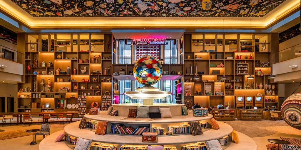 The ‘Fountain of Tales’, a colossal fountain with seating spaces and bookshelves featuring over 5,000 books — Photo by Accor