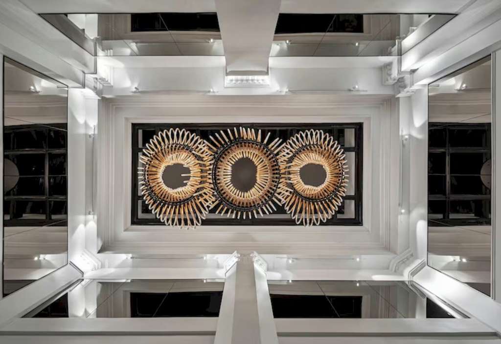 The atrium ceiling, featuring original building details, at the Glass Light Hotel & Gallery, Autograph Collection— Source: Baskervill